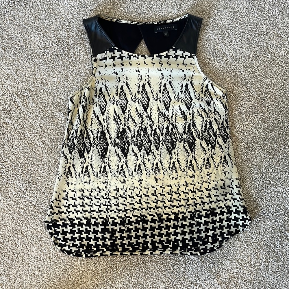 Black and white Sanctuary top with leather caps
